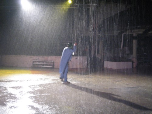 Scary creature sneaking up on unsuspecting guests, in the rain